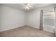 Empty bedroom with white walls, a ceiling fan, and a window with curtains at 8448 Se 161St St, Summerfield, FL 34491