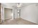 Bedroom with closet, neutral paint, carpet, and a view to the kitchen at 8448 Se 161St St, Summerfield, FL 34491