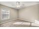 Empty bedroom with neutral walls, a ceiling fan, and a large window with blinds at 8448 Se 161St St, Summerfield, FL 34491