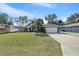 Front view of house showing landscaping and driveway at 8448 Se 161St St, Summerfield, FL 34491