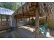 Relaxing pergola with thatched roof and hanging chairs at 8448 Se 161St St, Summerfield, FL 34491