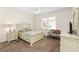 Bedroom with neutral carpet, a ceiling fan, a window, and classic furniture set at 9464 Se 132Nd Loop, Summerfield, FL 34491