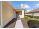 Welcoming front entrance with a covered porch and neatly landscaped surroundings at 9464 Se 132Nd Loop, Summerfield, FL 34491