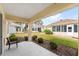 Back patio with views of the yard and surrounding properties. Serene outdoor living space at 9464 Se 132Nd Loop, Summerfield, FL 34491