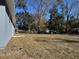 Large backyard with grassy area and mature trees at 38 Elm Rd, Ocala, FL 34472