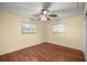 Well-lit bedroom with wood flooring and ceiling fan at 4710 Ne 8Th St, Ocala, FL 34470