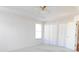 Bedroom with ceiling fan, closet and ample natural light at 10819 Sw 84Th Ter, Ocala, FL 34481