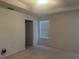 Bright bedroom with neutral walls and carpet at 10819 Sw 84Th Ter, Ocala, FL 34481