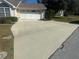 Large driveway with attached garage at 10819 Sw 84Th Ter, Ocala, FL 34481