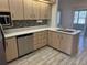 Kitchen with light wood cabinets, stainless steel appliances, and white countertops at 10819 Sw 84Th Ter, Ocala, FL 34481