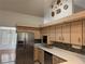 Bright kitchen featuring stainless steel appliances, light wood cabinets, and tiled backsplash at 10819 Sw 84Th Ter, Ocala, FL 34481