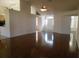 Spacious living room featuring hardwood floors, a ceiling fan, and a bright entryway with lots of light at 10819 Sw 84Th Ter, Ocala, FL 34481