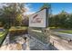 Stone community sign for Red Tail surrounded by lush landscaping and mature trees on a sunny day at 31771 Red Tail Blvd, Sorrento, FL 32776