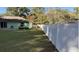 Large backyard with green grass and white vinyl fence at 35 Hemlock Terrace Dr, Ocala, FL 34472