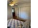 Bedroom with hardwood floors and access to another room at 35 Hemlock Terrace Dr, Ocala, FL 34472