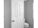 Small half bathroom with white toilet and grey walls at 3921 Sw 51St Ter, Ocala, FL 34474