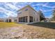 Two-story house with screened porch and grassy backyard at 3921 Sw 51St Ter, Ocala, FL 34474