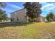 Two-story house with a large backyard and partial view of the street at 3921 Sw 51St Ter, Ocala, FL 34474