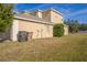 House exterior with side yard, trash cans, and landscaping at 3921 Sw 51St Ter, Ocala, FL 34474