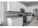 Well-equipped kitchen featuring white cabinets and granite countertops at 3921 Sw 51St Ter, Ocala, FL 34474