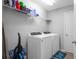 Laundry room with washer, dryer, and shelving at 3921 Sw 51St Ter, Ocala, FL 34474