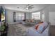 Bright living room with gray sectional sofa and large window at 3921 Sw 51St Ter, Ocala, FL 34474