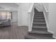 Modern staircase with gray carpeting and white railings at 3921 Sw 51St Ter, Ocala, FL 34474