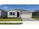 Charming single-story home with stone accents, a two-car garage, and a well-manicured front lawn at 4122 Nw 48Th Terrace Rd, Ocala, FL 34482