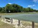 Outdoor basketball court with two hoops and wooden bench at 6821 Se 103Rd St, Belleview, FL 34420