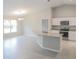 Kitchen with granite island, stainless steel appliances, and breakfast bar at 6821 Se 103Rd St, Belleview, FL 34420