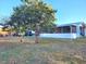 View of home's backyard and side at 711 Ne 43Rd St, Ocala, FL 34479