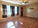 Bright living room featuring hardwood floors and large windows at 711 Ne 43Rd St, Ocala, FL 34479