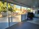 Screened porch overlooking the backyard at 711 Ne 43Rd St, Ocala, FL 34479