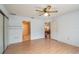 Spacious bedroom with light wood floors and ceiling fan at 8475 Sw 109Th Lane Rd, Ocala, FL 34481