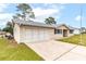 Tan house with garage and large yard at 8475 Sw 109Th Lane Rd, Ocala, FL 34481