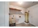 Laundry area with sink, shelving and water heater at 8475 Sw 109Th Lane Rd, Ocala, FL 34481