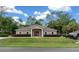 Community clubhouse with landscaping and parking at 9537 Sw 53Rd Cir, Ocala, FL 34476