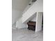 Bright living room with sleek floors, staircase, and a vintage piano adds charm at 26 Hemlock Cir, Ocala, FL 34472