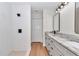 Modern bathroom with double vanity, granite countertops, and a tiled walk-in shower with matte black fixtures at 3496 Sw 149Th Ct, Ocala, FL 34481