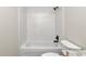 Simple bathroom with white subway tile and a bathtub at 3496 Sw 149Th Ct, Ocala, FL 34481