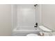 Bathroom features a white subway tiled shower and modern fixtures at 3496 Sw 149Th Ct, Ocala, FL 34481