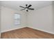 Spacious bedroom featuring hardwood floors and ceiling fan at 3496 Sw 149Th Ct, Ocala, FL 34481