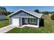Charming single Gathering home featuring a one car garage and covered front porch at 3496 Sw 149Th Ct, Ocala, FL 34481