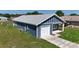 Single Gathering home featuring a one car garage and covered front porch at 3496 Sw 149Th Ct, Ocala, FL 34481