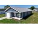 Charming single Gathering home featuring a one car garage and covered front porch at 3496 Sw 149Th Ct, Ocala, FL 34481