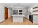 Modern kitchen featuring light gray cabinets, granite countertops, and stainless steel appliances at 3496 Sw 149Th Ct, Ocala, FL 34481