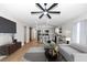 Open concept living room and kitchen with a ceiling fan and modern furnishings at 3496 Sw 149Th Ct, Ocala, FL 34481