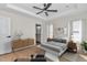 Tranquil main bedroom featuring neutral decor, recessed lighting, and ensuite bathroom access at 3496 Sw 149Th Ct, Ocala, FL 34481
