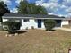 Charming one story home featuring a fresh paint job and a driveway leading to the attached garage at 41 Hickory Trak, Ocala, FL 34472