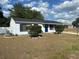 Charming single-story home featuring a freshly painted exterior and well-maintained landscaping at 41 Hickory Trak, Ocala, FL 34472